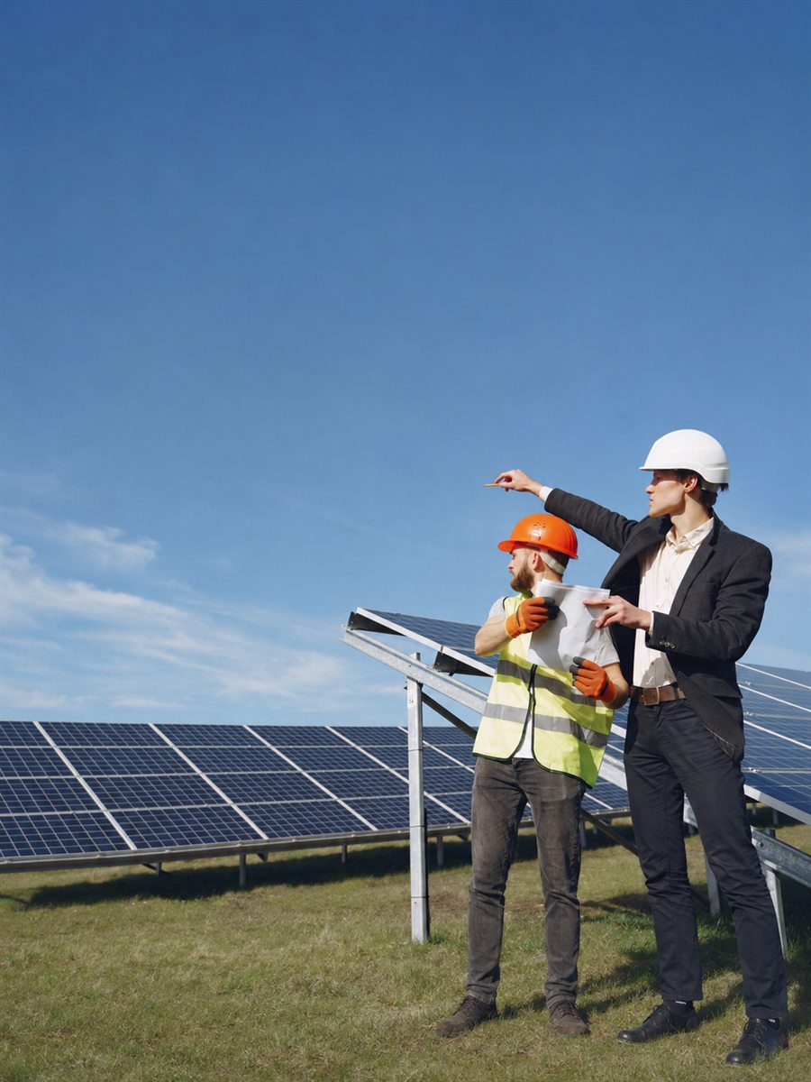 Solar project engineers inspecting panels