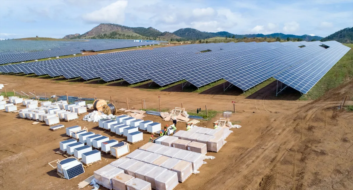 Utility-scale solar farm with packaged equipment during installation
