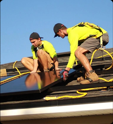 Engineers checking rooftop solar panels